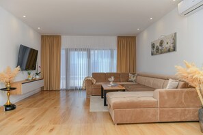 Big Living room with big sofa to relax and enyoy in the view