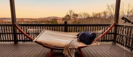 Get cozy in this hammock on the third floor Skydeck with relaxing mountain views!