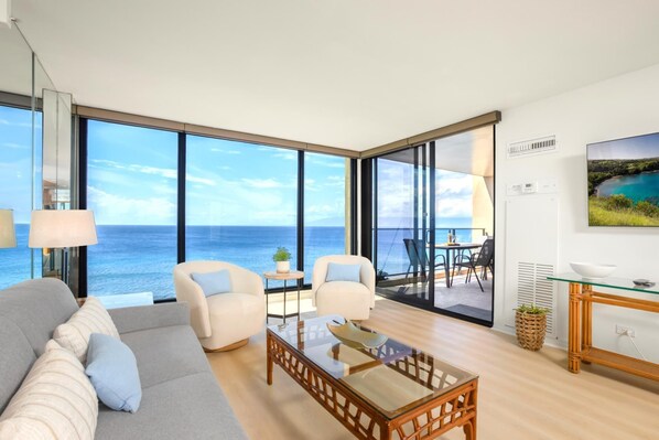 Spacious living room with panoramic ocean views and chic island-style decor. MAH-1006