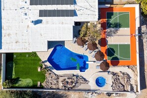 Take in the breathtaking aerial view of our property—sprawling spaces, stunning surroundings, and every luxury you need for a perfect getaway!