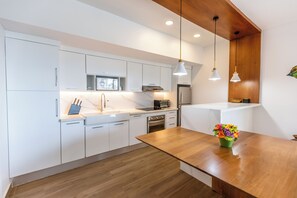 Fully equipped kitchen with a washer and dryer for your convenience.
