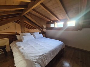 King size bed located on the upper floor mezzanine! With Luxury linens.