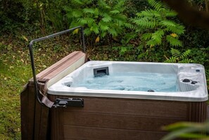 Garden with private hot tub and woodland surroundings