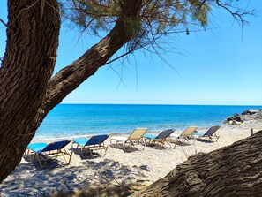 View of the sea and the beach with free sunbeds exclusively for guests.