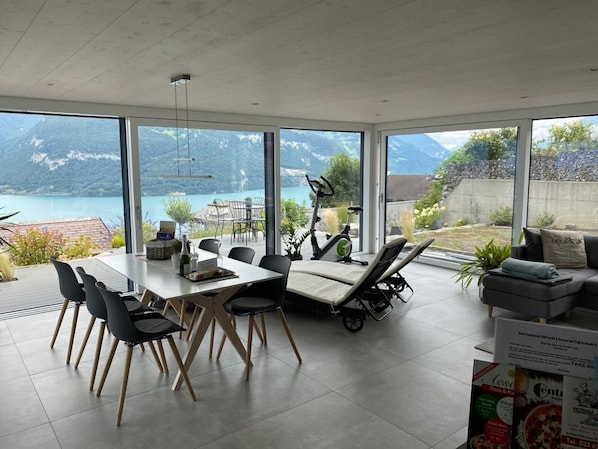 Inside with a large glass front and a fantastic view of the mountains and Lake Thun