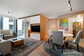 Living room and dining room with a balcony and a social toilet