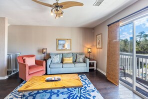 Kate's Place at 13554 Perdido Key Drive - Living area. Note baby gates at top of stairs are in place for families who need them. Babies & Pets are welcome.
