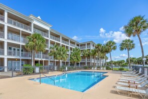 Beach Vibe - Grand Caribbean Eat Unit 213 - Grand Caribbean has a sparkling blue pool for guests to enjoy. Beach Vibe overlooks pool from a grande extended balcony.