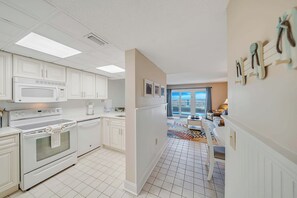 The fully equipped kitchen features quartz countertops and has everything you need to prepare meals for family & friends.
