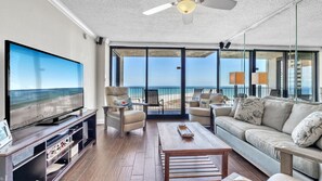 Cozy coastal living with stunning Gulf views. Relax in plush seating, enjoy the large TV, or step onto the balcony to soak in the beach breeze.