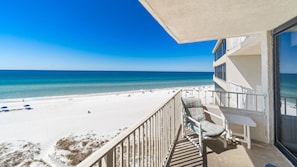 View of the beach and water from the balcony.