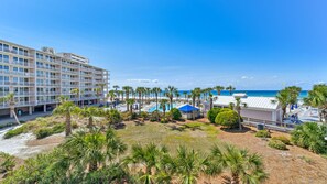 Balcony view of the beach and water.