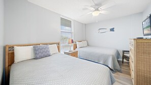 Guest bedroom with two full size beds.