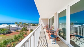 Balcony with views of the community pool and beach.