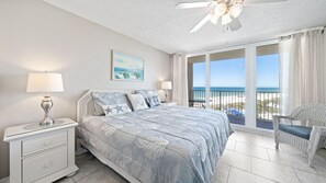 Main bedroom with king size bed and access to balcony.