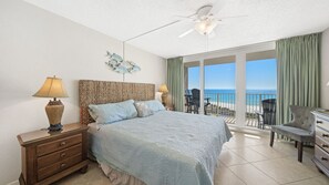Main bedroom with a King size bed and a sliding glass door to the balcony.