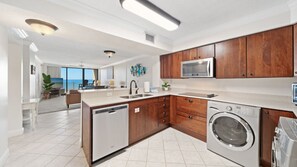 Fully equipped kitchen with stainless steel appliances.