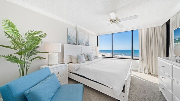King size bed with amazing view of the beach and water.