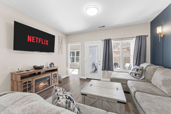 Relax while watching your favorite show on the 65" TV