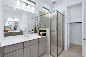 This king ensuite features dual vanities as well as a closet & glass shower