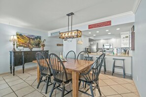 The spacious kitchen is updated & well stocked for preparing family meals.