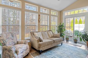 Kick back & enjoy a great book and a glass of wine in the sunroom!