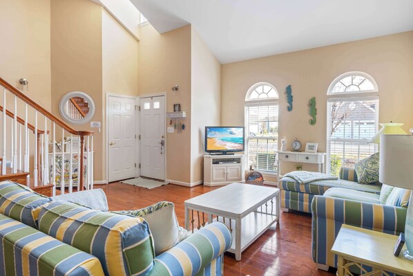 Curl up in the coastal living room & stream your favorites on the smart TV