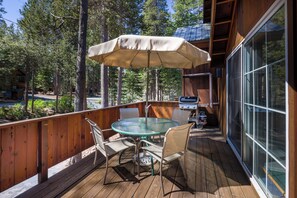 Outdoor dining with seating and gas BBQ grill