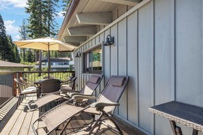 Lounge chairs and outdoor dining on the balcony