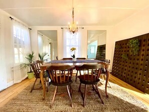 Antique dining set with vintage French riddling racks and crystal chandelier
