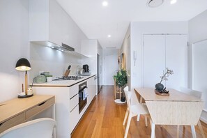 Prepare your home-cooked meals in the compact kitchen, complete with an oven, dishwasher and all the essentials.