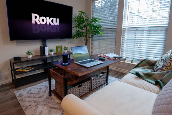 Cozy Living Room. The coffee table with lifting to top to create a working space.