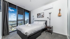 Bright bedroom with city view.