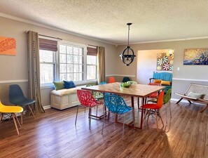 12 seating dining area. Colored chairs are useable throughout the house.