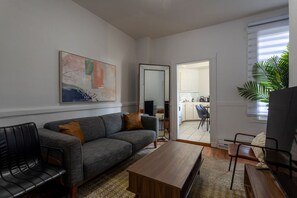 Chic and connected—living space flows effortlessly into the kitchen.