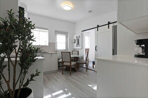 Dining Area – A bright and inviting space with natural light, perfect for shared meals and morning coffee.