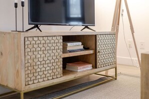 Elegant entertainment console with thoughtful design and storage