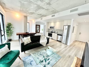 A seamless flow between the seating area and open-concept kitchen, designed for comfort and functionality.