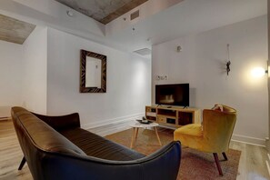 Elegant and inviting living area with a cozy ambiance, contemporary decor, and an open layout perfect for unwinding after a long day.
