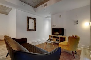 Elegant and inviting living area with a cozy ambiance, contemporary decor, and an open layout perfect for unwinding after a long day.