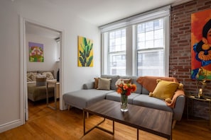Spacious layout with natural light and eclectic decor flowing room to room