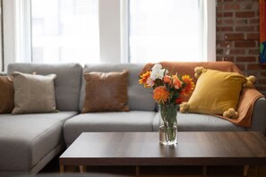Muted neutrals meet citrusy pops in this bright and balanced lounge nook