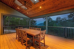 Dine on the screened-in porch with seating for 8 to take in the sunset views.