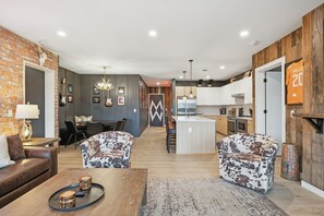 Living room with pull out sofa, fireplace, Smart TV, patio access and more