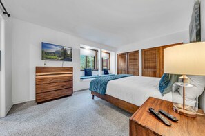 Master bedroom: Smart TV, king bed, main floor