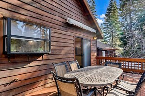 Front balcony: Dining table, chairs 
