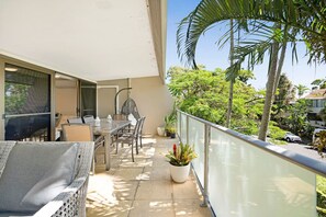 Balcony space with outdoor dining and outdoor furniture