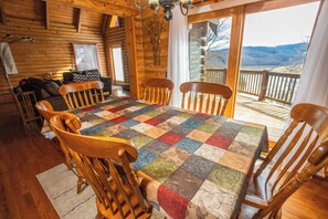 Gather around this colorful and inviting dining space with stunning views—perfect for family meals or romantic evenings.
