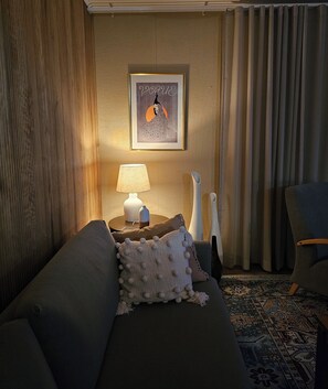 Living room in the evening. With lightning you can arrange a cozy atmosphere.