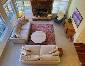 Large living room with plenty of comfy seating for large groups